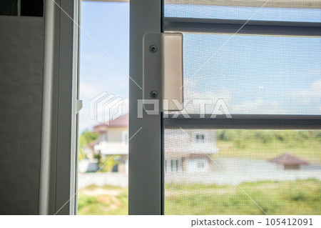 Open mosquito net wire screen on house window protection against insect 105412091