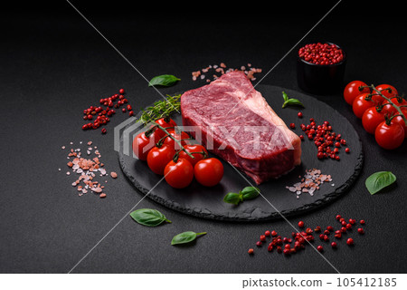 Fresh raw beef striploin steak with salt, spices and herbs Fresh raw beef striploin steak with salt, spices and herbs 105412185
