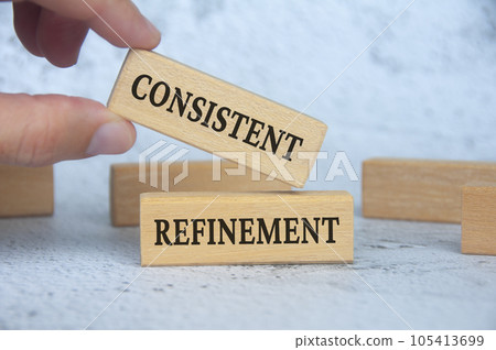 Consistent refinement text on wooden blocks. Business strategy concept. 105413699