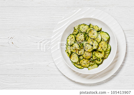 Sunomono, Japanese Cucumber Salad in a white bowl 105413907