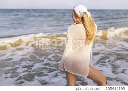 Sexy Woman With Topless Slim Body On Sea Beach At Sunset Sexy Woman With Topless Slim Body On Sea Beach At Sunset 105414193