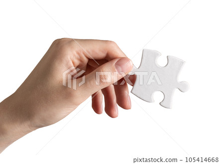 Hand holding puzzle piece, jigsaw element isolated on white background 105414668