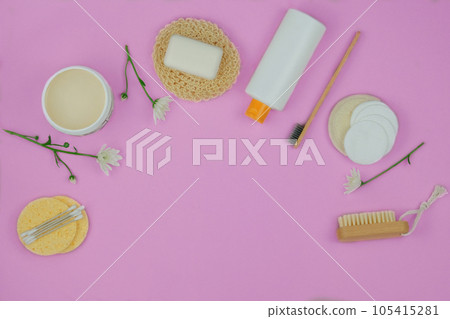 Washcloths, shampoo, soap and other accessories for hygiene in pink background. Copy space. Top view. 105415281