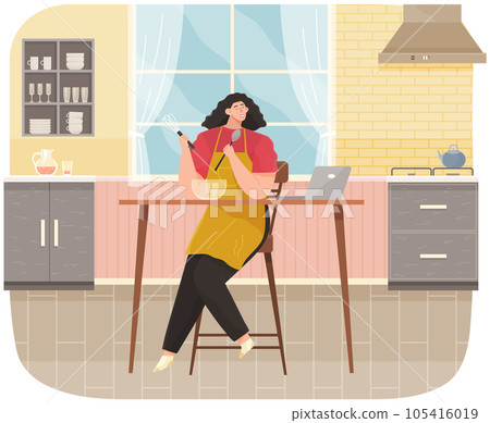 Young woman cooking salad in kitchen room stands near table and watching culinary video blog 105416019
