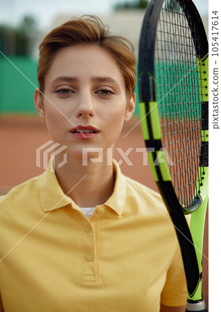 Closeup face portrait of young teenage woman tennis player 105417614