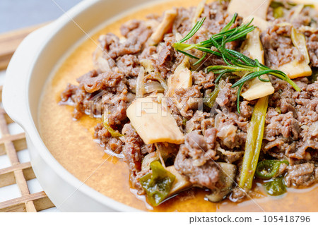Bulgogi, korean food, Bulgogi is prepared with beef that has been marinated in soy sauce, honey, minced green onion, garlic, sesame seeds, and pepper, and then grilled. The excess liquid can be mixed Bulgogi, korean food, Bulgogi is prepared with beef that has been marinated in soy sauce, honey, minced green onion, garlic, sesame seeds, and pepper, and then grilled. The excess liquid can be mixed 105418796