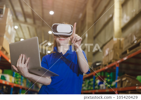 smart worker using modern advance technology digital VR device to control operate manage industry products stock warehouse 105420429