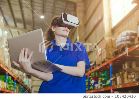 smart worker using modern advance technology digital VR device to control operate manage industry products stock warehouse 105420430