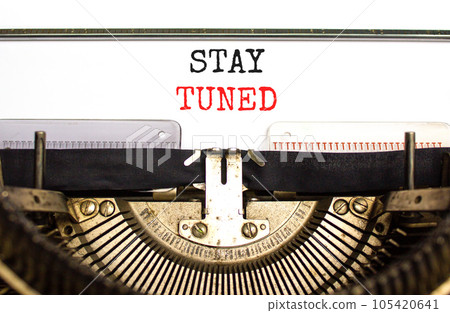 Stay tuned symbol. Concept words Stay tuned typed on beautiful old retro typewriter. Beautiful white background. Business, support, motivation, psychological and stay tuned concept. Copy space. 105420641