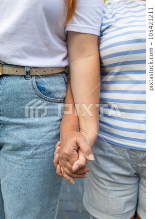 Caring elderly grandma wife holding hand supporting senior grandpa husband give empathy care love, old married grandparents couple together two man and woman hope understanding concept, close up view 105421211