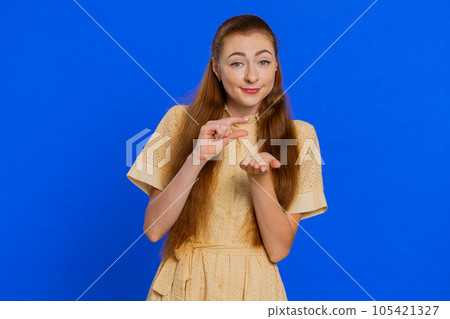 Woman showing a little bit gesture with sceptic smile, showing minimum sign, measuring small size. Woman showing a little bit gesture with sceptic smile, showing minimum sign, measuring small size. 105421327