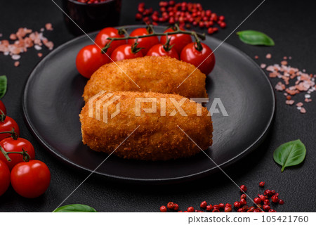 Delicious baked potato cutlet stuffed with chicken and vegetables, spices and salt Delicious baked potato cutlet stuffed with chicken and vegetables, spices and salt 105421760