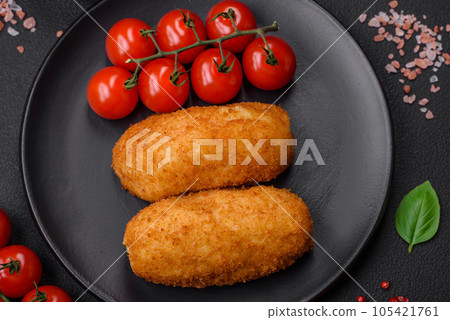 Delicious baked potato cutlet stuffed with chicken and vegetables, spices and salt Delicious baked potato cutlet stuffed with chicken and vegetables, spices and salt 105421761