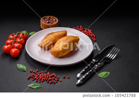 Delicious baked potato cutlet stuffed with chicken and vegetables, spices and salt 105421788