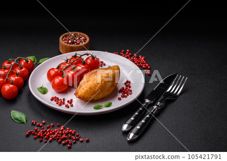 Delicious baked potato cutlet stuffed with chicken and vegetables, spices and salt 105421791