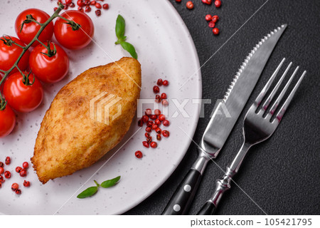 Delicious baked potato cutlet stuffed with chicken and vegetables, spices and salt 105421795