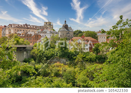 Kamianets-Podilskyi cityscape with Novoplanovsky bridge over the Smotrytsky canyon, Ukraine. Kamianets-Podilskyi cityscape with Novoplanovsky bridge over the Smotrytsky canyon, Ukraine. 105422330