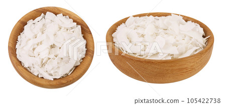 Coconut flakes or chips in wooden bowl isolated on white background. Top view. Flat lay 105422738