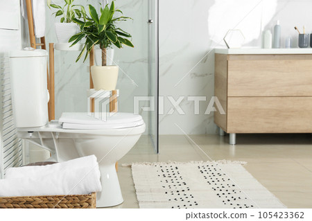 Stylish toilet bowl in modern bathroom interior Stylish toilet bowl in modern bathroom interior 105423362