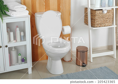 Stylish toilet bowl in modern bathroom interior 105423365