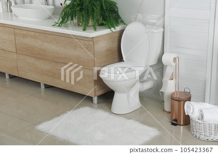 Stylish toilet bowl in modern bathroom interior 105423367