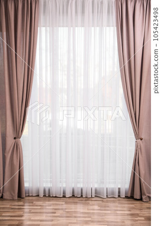 Window with elegant curtains in empty room 105423498