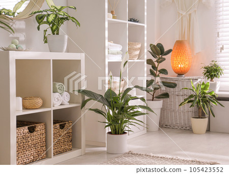 Elegant interior of modern bathroom with green plants 105423552