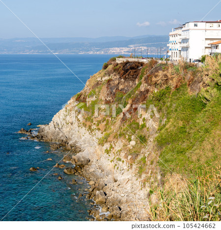 View of coastline in southern Italy. Scenic view from on top cliff looking out to sea. Calabria coastline with eroded cliff 105424662