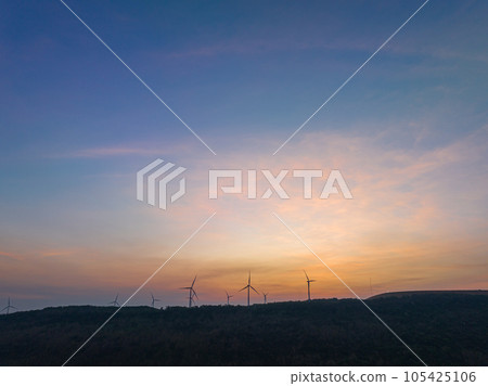 aerial view wind turbine viewpoint at Lamtakong dam,Nakhonratchasima, Thailand. amazing sky in sunrise above Lamtakong dam beautiful reflection on the large pond. Gradient color. Sky texture,  105425106
