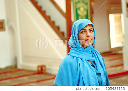 a woman in a headscarf a woman in a headscarf 105425133