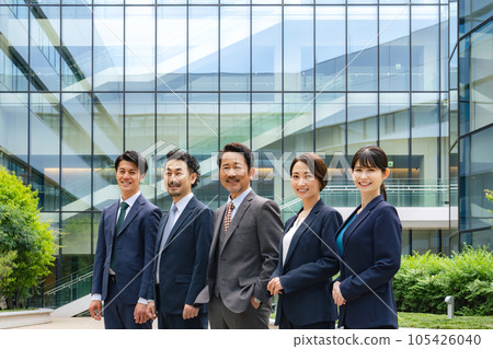 A group of executive men and women business people lined up with a smile A group of executive men and women business people lined up with a smile 105426040