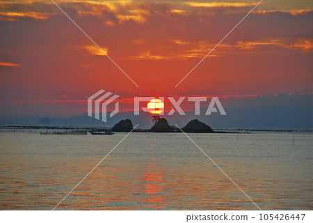 The sun rising from the sea The sun rising from the sea 105426447