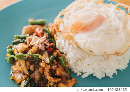 Khao Kraprao Moosub Khai Dow or Thai rice stir-fried minced pork with fried egg Khao Kraprao Moosub Khai Dow or Thai rice stir-fried minced pork with fried egg 105428485