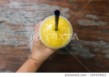 mango juice, mango smoothie or fruit juice 105429022