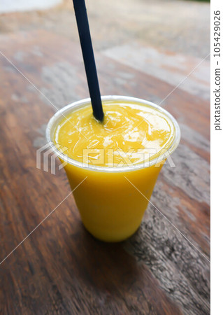 mango juice, mango smoothie or fruit juice 105429026