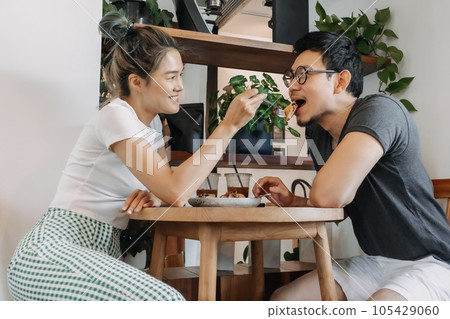 Sweet couple lover flirting date in the cafe. Sweet couple lover flirting date in the cafe. 105429060