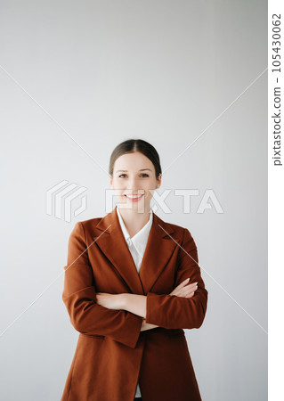 Smiling caucasian young businesswoman bank employee worker manager boss ceo looking at camera, using tablet, laptop and notepad online isolated in white background. 105430062