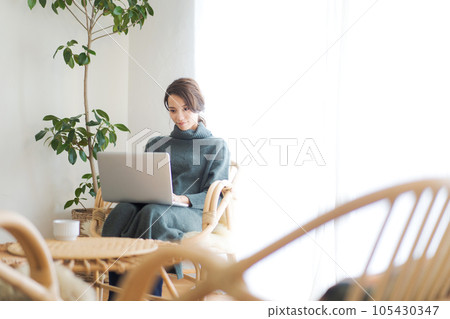 Photo of a woman operating a computer 105430347