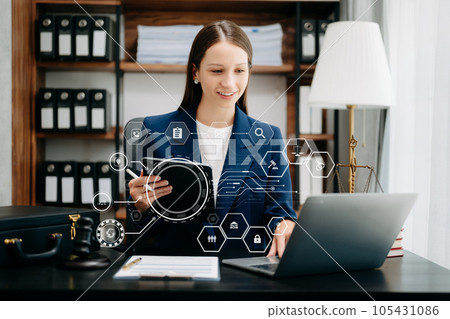 Beautiful Caucasian woman lawyer working and gavel, tablet, laptop in front, Advice justice and law concept. Beautiful Caucasian woman lawyer working and gavel, tablet, laptop in front, Advice justice and law concept. 105431086