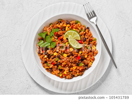 Mexican ground beef casserole with rice, beans 105431789