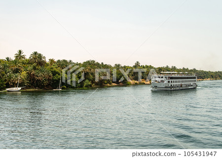 Panoramic view of fertile banks of Nile and everyday life during river cruise River near Luxor Egypt direction assuan Panoramic view of fertile banks of Nile and everyday life during river cruise River near Luxor Egypt direction assuan 105431947