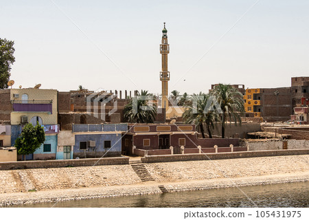 Panoramic view of fertile banks of Nile and everyday life during river cruise River near Luxor Egypt direction assuan 105431975