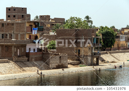 Panoramic view of fertile banks of Nile and everyday life during river cruise River near Luxor Egypt direction assuan 105431976
