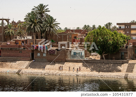 Panoramic view of fertile banks of Nile and everyday life during river cruise River near Luxor Egypt direction assuan 105431977