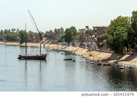 Panoramic view of fertile banks of Nile and everyday life during river cruise River near Luxor Egypt direction assuan Panoramic view of fertile banks of Nile and everyday life during river cruise River near Luxor Egypt direction assuan 105431979