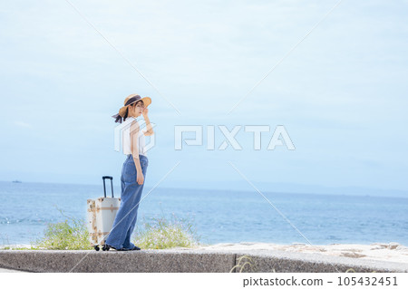 A woman looking at the sea 105432451
