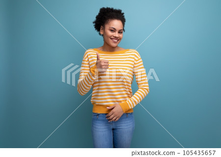 successful happy brunette latin young woman with ponytail smiling on studio background successful happy brunette latin young woman with ponytail smiling on studio background 105435657