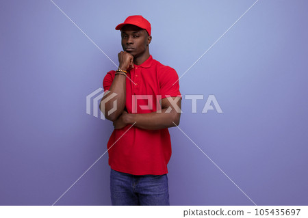 clothing for identity and branding. successful young handsome african man in red corporate t-shirt clothing for identity and branding. successful young handsome african man in red corporate t-shirt 105435697