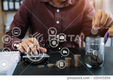accountant working on desk in office using calculator and laptop to calculate budget. concept finance and accounting in morning light. 105435856