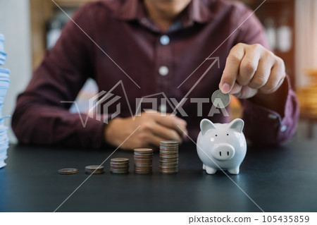 accountant working on desk in office using calculator and laptop to calculate budget. concept finance and accounting in morning light. accountant working on desk in office using calculator and laptop to calculate budget. concept finance and accounting in morning light. 105435859